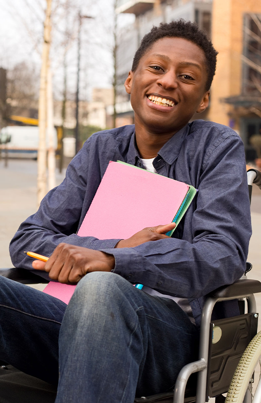Smiling boy in a wheelchair